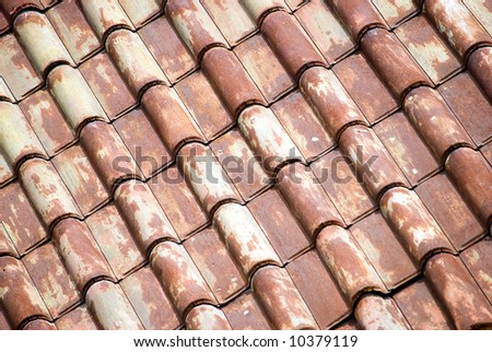Antique metal roof tiles running diagonally