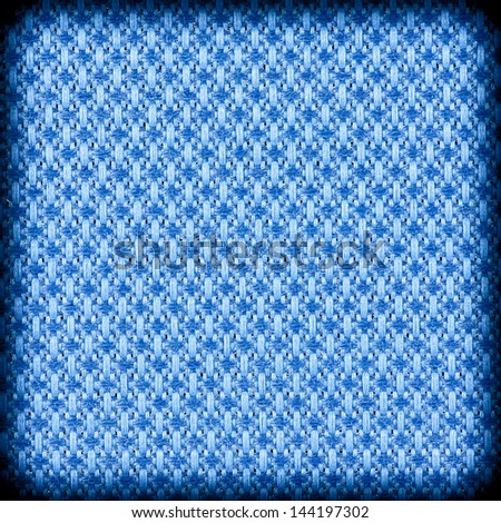 Background texture of bright blue fabric closeup with vignette