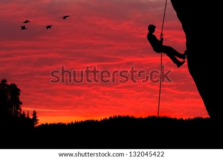Rock Climber Rappelling Silhouette