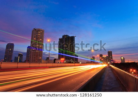 Night street view of Bangkok city on Taksin Bridge