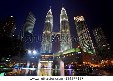 KUALA LUMPUR, MALAYSIA - APRIL 13: Fountain light show of Petronas Twin Towers on April 13, 2013 in Kuala Lumpur Malaysia. Petronas Twin Towers were the tallest buildings (452m)  during 1998-2004.