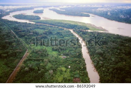 The Rio Napo in the Ecuadorian Amazon viewed from the air, Rio Jivino in foreground and a road built by oil companies bringing colonists who cut the foreground forest