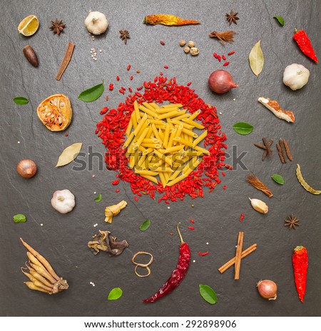 Pasta with spices on background for cooking and decorate.