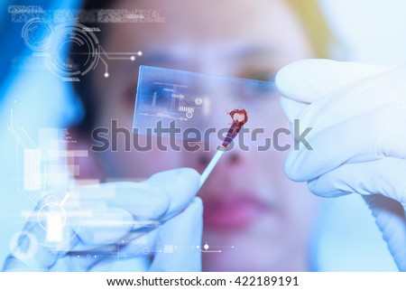 Life science professional pipetting human serum media containing HIV infected cells from petri dish to microtiter plate. High protection degree work,science content,science research,science background