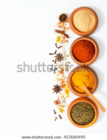Group of indian spices and herbs on white background, top view mix indian spices and herbs difference ware on white background with copy space for design vegetable, spices, herbs or foods content