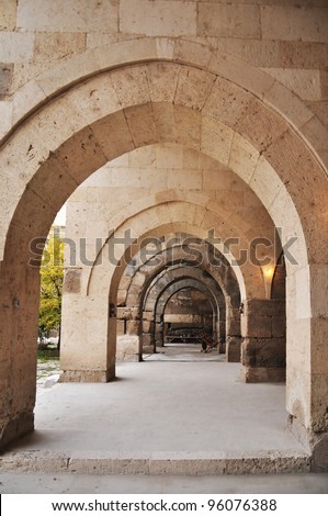 Caravanserais along the ancient silk road provided lodging, food and essential services to trade caravans. Built like forts, they offered security as well. The image shows the covered corridors.