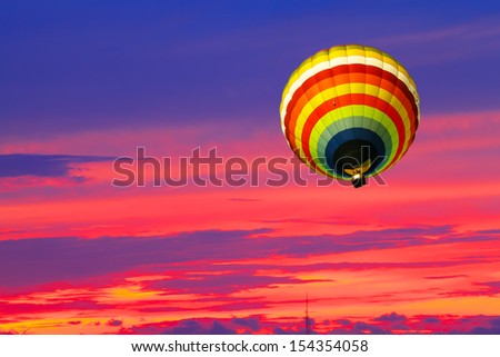 Balloon on Sunset / sunrise with clouds, light rays and other atmospheric effects