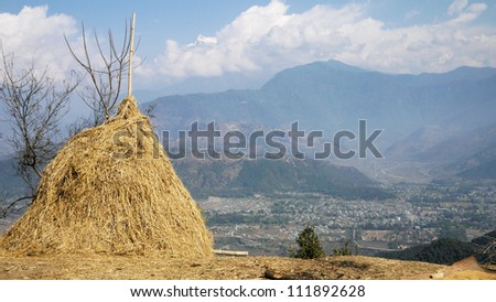 Nepal farming with hay on mountain with aerial bird view of town