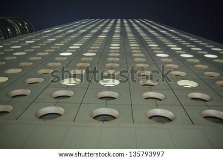 HONG KONG -  MARCH 7: the round windows of Jardine House in Central on March 7 2013. It is the Hong Kong's first modern skyscrape. the round windows is one of the characteristic