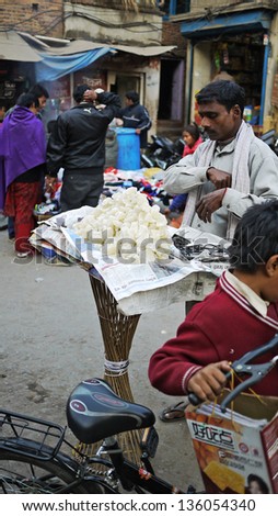 KATHMANDU, NEPAL - JANUARY 29: a hawker sells sugar in Patan area on 29 Jan 2010. the United Nations list Nepal as one of the Least developed country in the world