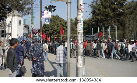 KATHMANDU, NEPAL- JANUARY 20: Supporters of the Communist Party of Nepal (Maoist) protest in Katmandu, on 20 Jan 2010. The protests have been largely peaceful and the polices are armed to stand by
