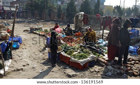 KATHMANDU, NEPAL - JANUARY 20: hawker sell the fruits in a dirty market in kathmandu on 20 January 2010. The United Nations list Nepal as one of the Least developed country in the world