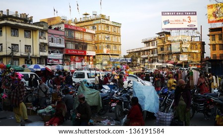 KATHMANDU, NEPAL  - JANUARY 29: residents shopping in a crowded market in Kathmandu on 29 January 2010. The United Nations list Nepal as one of the Least developed country in the world