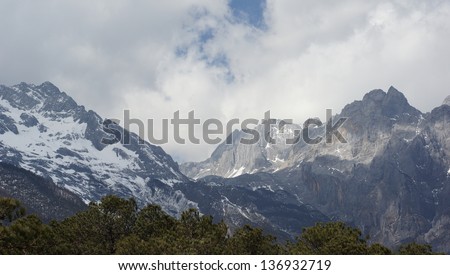 snow mountain with the cloudy day - Jade Dragon Snow Mountain or Mount Yulong