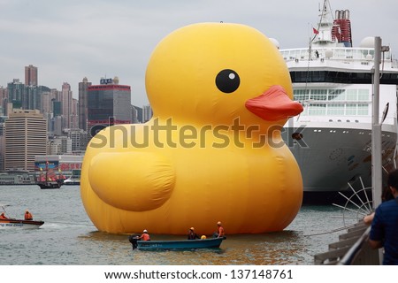 HONG KONG - MAY 2: the workers try to stable the duck in Hong Kong on May 2 2013.Giant 'Rubber Duck' Sculpture By Florentijn Hofman, come to hong kong and draw the attention of hong kong people