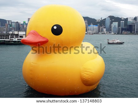 HONG KONG - MAY 2:the rubber duck swim in Victoria Harbour on May 2 2013. Giant \'Rubber Duck\' Sculpture By Artist Florentijn Hofman, visit Hong Kong today which draw the attention of local