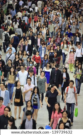 HONG KONG -MAY 13: The crowd of people in tunnel of Central subway station on May 13 2013. 6 p.m. is the peak of rushing hour in central because all people come off work