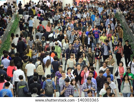 HONG KONG -MAY 13: Crowd of people, going in and out forward, in tunnel of Central MTR subway station on May 13 2013. 6 p.m. is the peak of rushing hour in central because all people come off work