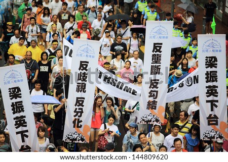 HONG KONG - JULY 1: The Hong Kong 1 July protests in Hong Kong on 1 July 2013. the protesters request the political reform, the economic crisis and the solution of housing problem