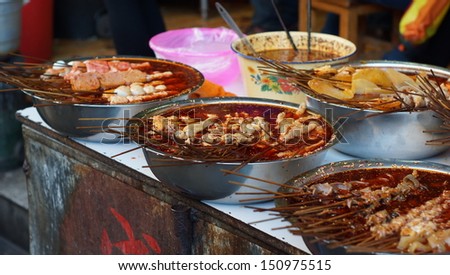 LIJIANG, CHINA -FEB 18: the heavily spiced food in Lijiang old town on Feb 18 2012. Food safety is now be a concerned topic while china food safety issues is breaking out everyday