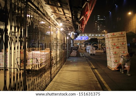 HONG KONG, AUGUST 14: workers move the boxes in Yau Ma Tei Wholesale Fruit Market on 14 august 2013. it take 80% fruit wholesale in hong kong and one of main asia fruit wholesale market
