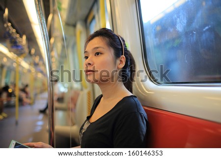 Girl in the deep thinking about her next destination on the train