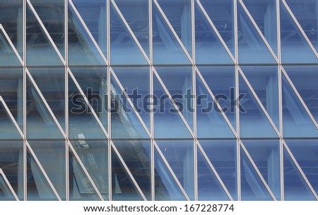 Abstract triangles windows with the reflection of other buildings in hong kong city,Central financial zone
