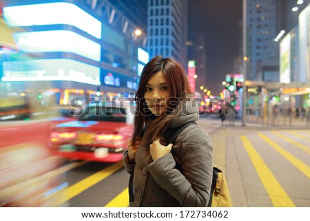 Girl lost in the big city hong kong, stand in middle road at the moment when travel