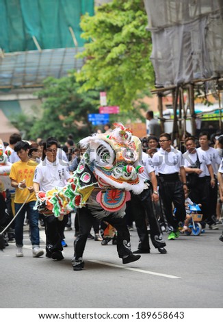 HONG KONG, APRIL 22: People dance the lion in the Tin Hau birthday in Yuen Long on 22 april 2014. Tin Hau, Goddess of Sea in china. Locals rally dedicated to her for safety during the coming year.