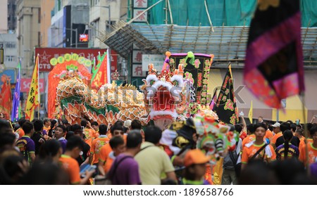 HONG KONG, APRIL 22: crowd watch the dancing dragon in Tin Hau birthday in Yuen Long on 22 april 2014. Tin Hau, Goddess of Sea in china. Locals rally dedicated to her for safety during the coming year