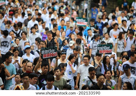 HONG KONG,JULY 1: People protest on the street in hong kong on 1 July 2014. People protest for urban development, housing issue, and mainland china policy to hong kong,