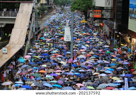 HONG KONG,JULY 1: colorful umbrellas  with People protest on the street in hong kong on 1 July 2014. People protest for urban development, housing issue, and mainland china policy to hong kong,