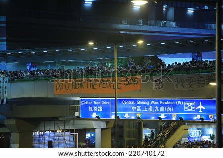HONG KONG, SEPT.30: protesters show the banner in Admiralty on 30 September 2014. after riot police fire tear shell to the peaceful protesters on 28 sept, more people join the protest