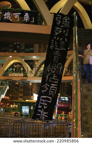 HONG KONG,OCT.1: protesters show banner ' keep going on, hk