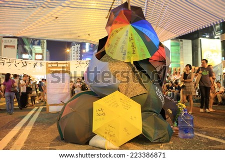 HONG KONG,OCT. 12:people hang the yellow umbrella, symbol of revolution in ocuppy protest  in Mong Kok on 12 october 2014.  Umbrella revolution two week ago, people is still insist on it