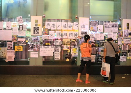 HONG KONG,OCT. 12:people read the democracy wall in ocuppy protest  in Mong Kok on 12 october 2014.  Umbrella revolution two week ago, people is still insist on it