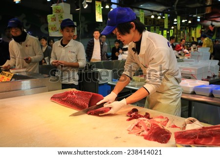 SHIRAHAMA,JAPAN, NOV. 22: fish worker fillet the Tuna ,make a auction at tore tore fish market in shirahama on 22 November 2014. as the growth of sushi and sashimi demand, the species is overfished