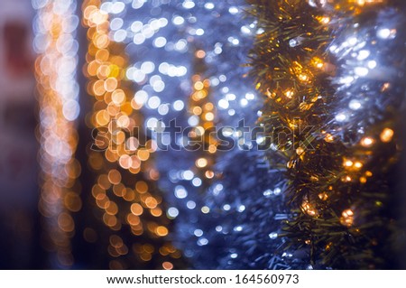 Defocused abstract blue and yellow christmas lights background with bokeh