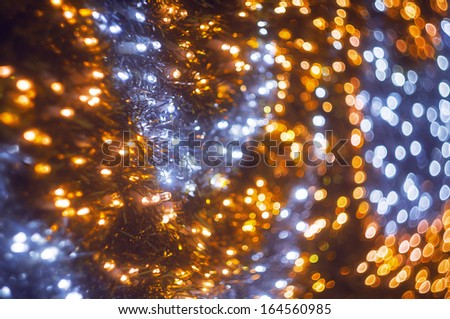 Defocused abstract blue and yellow christmas lights background with bokeh