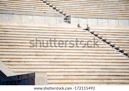 Rows of stone seats at stadium