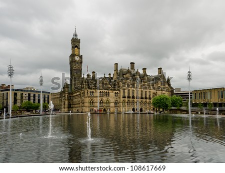 The splendidly Gothic Bradford Town Hall seen across the City Park fountains, the largest water feature of its type in the UK.
