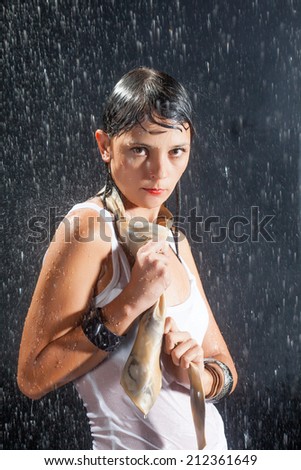 Brunette woman under rain
