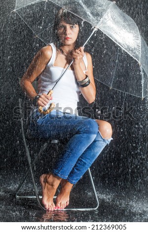 Brunette woman under rain
