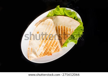 Pita bread pizza on fresh lettuce