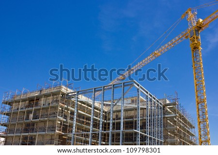 High rise construction and crane