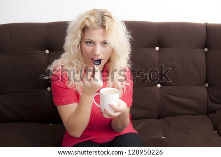 Young Blonde Woman with a coffee mug