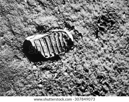 Astronaut\'s boot print on lunar (moon) landing mission. Elements of this image furnished by NASA.