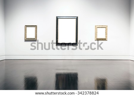 Blank painting frames in art gallery.