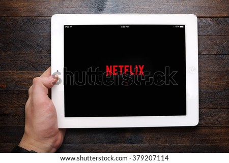 BEKASI, INDONESIA - FEBRUARY 20, 2016: Netflix app loading on iPad. Netflix is a global provider of streaming movies and TV series, and now has over 75 million subscribers.
