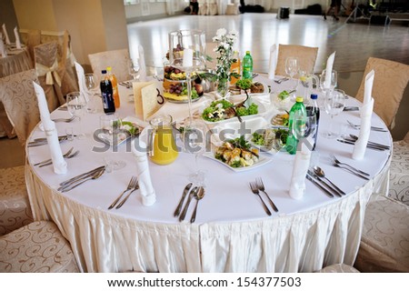 Table crammed with dishes on the party for guests / the cake, fruits and fruit desserts